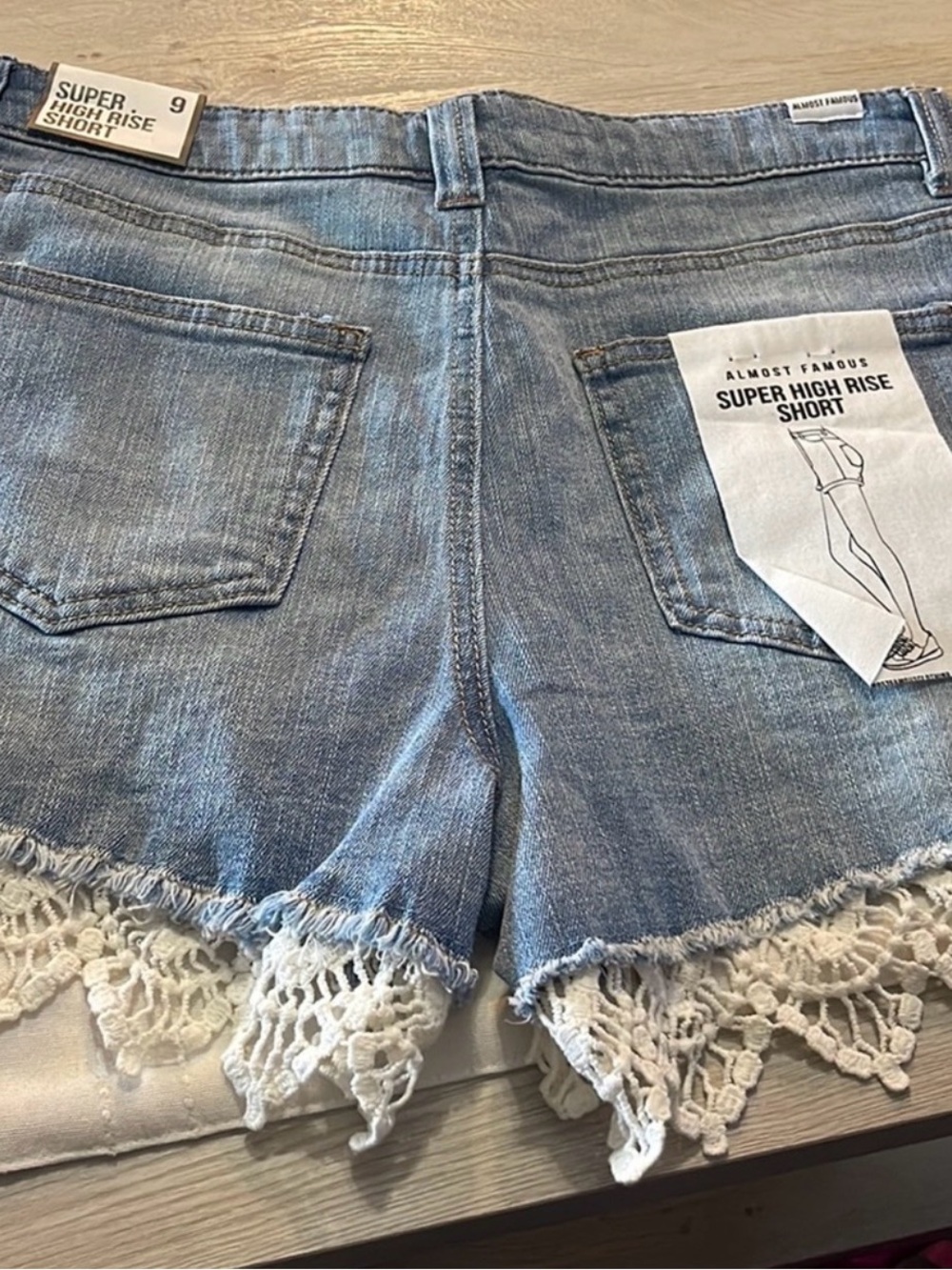 Almost Famous Light Blue Distressed Denim Shorts with White Lace - Picture 2 of 4